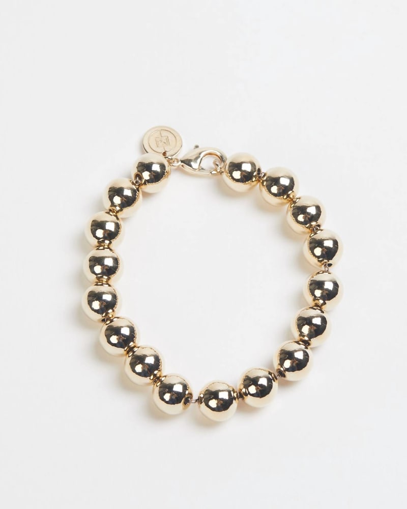 Front of a size O/S Large Gold Ball Bracelet in Gold in Gold by Eklexic. | dia_product_style_image_id:331681